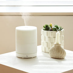 Edens Garden Pearl Diffuser white top view showing compact bedside presence for a calm space.