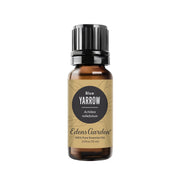 Edens Garden Yarrow Blue Oil bottle on a clean surface for calming aromatherapy.