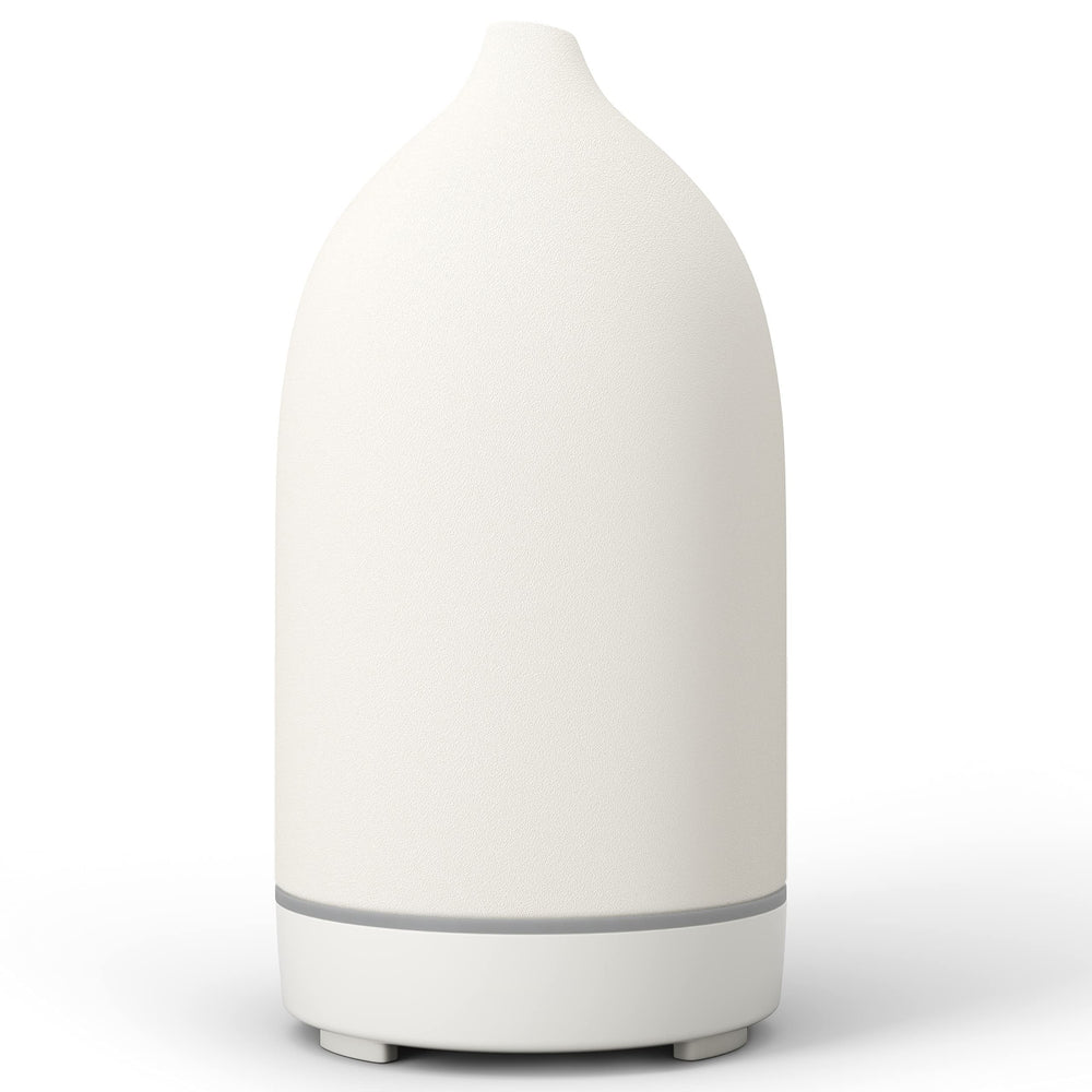 ENILYM essential oil diffuser ceramic white closeup showing handcrafted craftsmanship and compact form