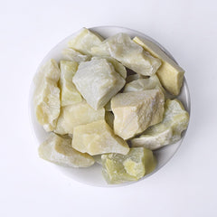 Erliway Yellow Jade raw crystal side view showing natural color and texture.