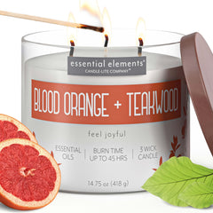 Essential Elements Blood Orange Teakwood candle label highlights premium fragrance for vibrant spaces