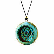 EternalOrgone Tree of Life pendant in turquoise resin enhances focus during meditation.