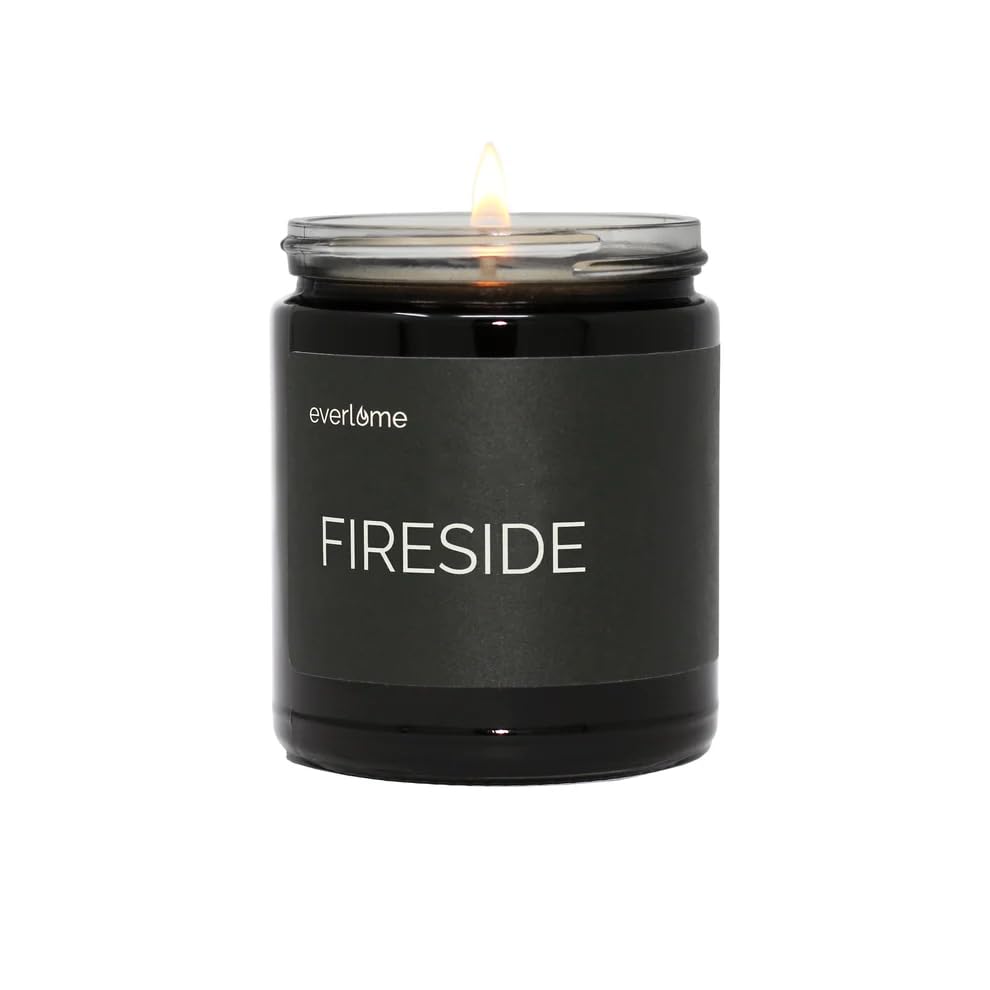 Everlume Fireside candle in a black glass jar creates cozy, fireside ambiance.