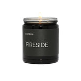 Everlume Fireside candle in a black glass jar creates cozy, fireside ambiance.