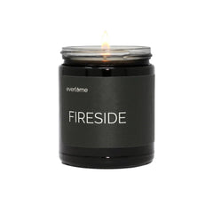 Everlume Fireside candle in a black glass jar creates cozy, fireside ambiance.