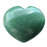 Favoramulet green aventurine heart stone held in hand for calming focus and mindful touch.