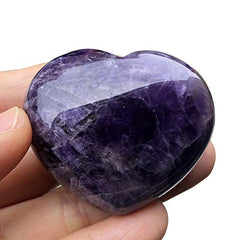 Favoramulet handcarved amethyst heart stone closeup showing unique patterns