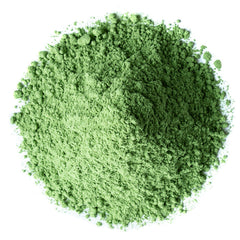 Food to Live wheatgrass powder dissolving in water for a healthy drink