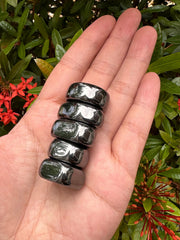 GAF TREASURES magnetic hematite stones arranged for grid work and focus.