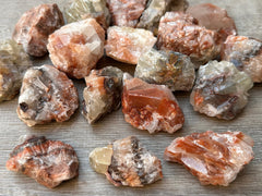 GAF TREASURES raw red-brown calcite stone showing natural texture and color.