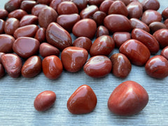 Polished Red Jasper close-up showing rich color variations and smooth texture