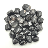 GEMSCITE Black Tourmaline tumbles in a pouch for home decor and calm ambiance.