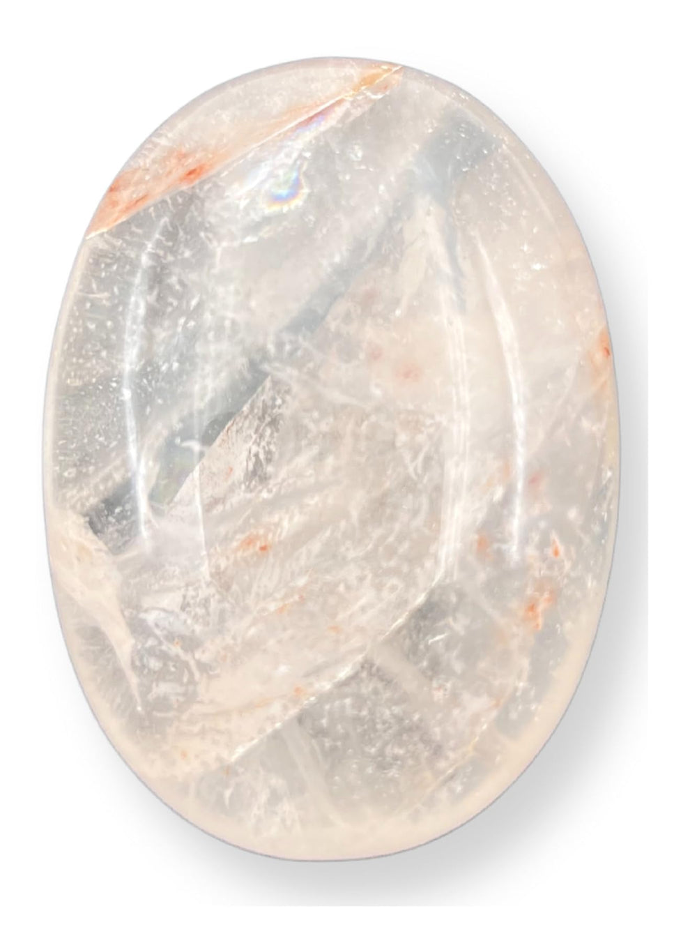 GEMSCITE clear quartz palm stone 2in held for relaxed focus and calm.