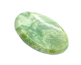 GEMSCITE Serpentine worry stone held for calm focus.