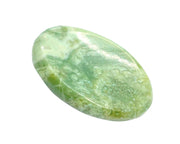 GEMSCITE Serpentine worry stone held for calm focus.