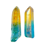 GEMSCITE Yellow Aqua Aura Quartz point glowing on a display for meditation