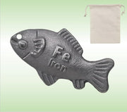 Generic Lucky Iron Fish in a pot infusing iron into soup