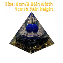Generic orgone pyramid close-up showing amethyst ball and gold leaf detail.