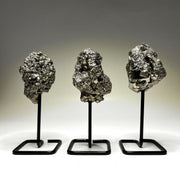 Generic pyrite cluster on metal stand enhances display and energy accents.