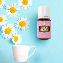 German Chamomile essential oil label on a dark glass bottle.