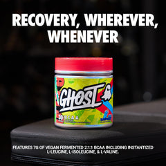 GHOST BCAA Blue Raspberry being poured into a shaker for post-workout use