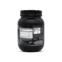 Glass of GNC AMP Sustained Cinnamon Toast shake ready for post-workout fueling.