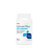 GNC Calcium Plus Magnesium with Vitamin D-3 1000mg bottle on a kitchen counter; supports daily bone health