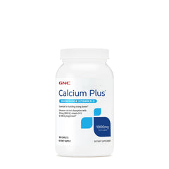 GNC Calcium Plus Magnesium with Vitamin D-3 1000mg bottle on a kitchen counter; supports daily bone health