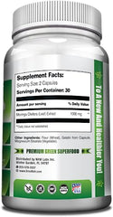 GreeNatr Pure Moringa capsules closeup reveals veggie capsules for easy swallowing.
