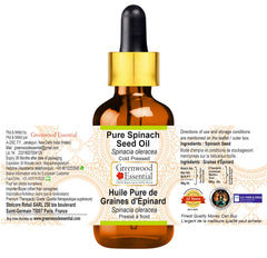 Close-up of Greenwood Essential Spinach Seed Oil dropper releasing oil for skin nourishment.