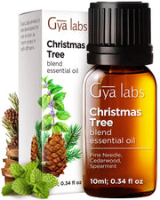Gya Labs Christmas Tree Oil bottle pour for a fresh, inviting holiday aroma.