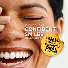 Gya Labs Clove Bud Oil applied to teeth and gums for oral care routines.