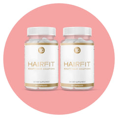 HAIRFIT vitamins bottle label closeup highlights key ingredients for stronger hair support.