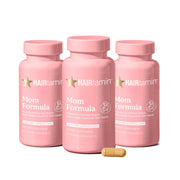 HAIRtamin MOM bottle closeup highlighting prenatal vitamins for hair health during pregnancy.