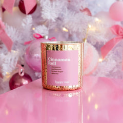 Happy Wax Cinnamon Roll candle releasing warm fragrance throughout room