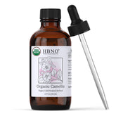 HBNO Organic Camellia Oil bottle closeup, premium formula for smooth skin