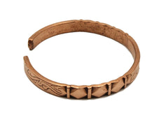 Healing Lama copper bracelet carved detail shows intricate work and lasting finish.