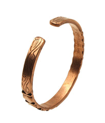 Healing Lama copper bracelet closeup texture reveals high gauge, smooth carving, rich color.