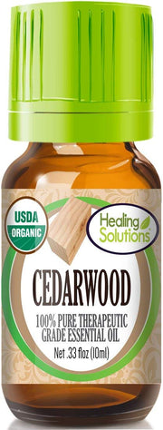 Healing Solutions Cedarwood Oil bottle close-up for pure aromatherapy use.