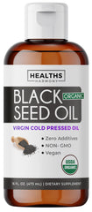 Healths Harmony black seed oil liquid bottle pour demonstrating easy daily dosing.