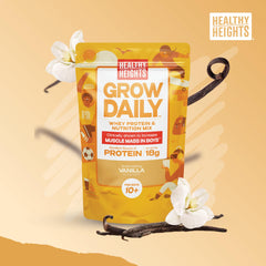 Healthy Heights vanilla protein scoop beside the tub for precise measuring.