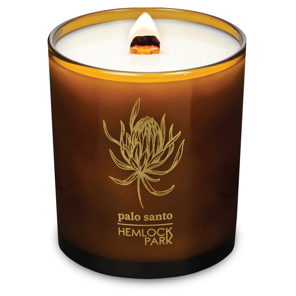 Hemlock Park Amber & Gold candle with label, showcasing natural coconut wax for a calming home ambiance.