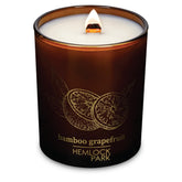 Hemlock Park Bamboo Grapefruit candle with wood wick showing a steady burn