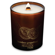 Hemlock Park Bamboo Grapefruit candle with wood wick showing a steady burn