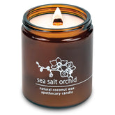 Hemlock Park crackling wick candle in amber jar creates cozy ambiance.