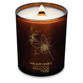 Hemlock Park Sea Salt Orchid candle jar closeup highlighting coconut wax for clean burning.