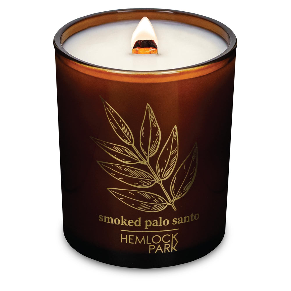 Hemlock Park wood wick candle closeup enhances cozy evenings with steady flame.