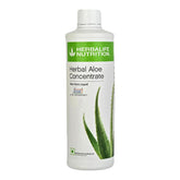 Herbalife Herbal Aloe Concentrate bottle being poured for a refreshing digestion-supporting drink.