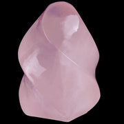 Hguxmcu Natural Rose Quartz Flame Tower placed on an altar for meditative focus