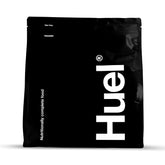 Huel Black Vanilla bottle pouring for a quick meal on the go.